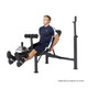 The Olympic Bench Competitor CB-729 in use by model - leg extensions