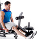 The Marcy Deluxe Olympic Weight Bench MKB-957 Leg Developer used with Olympic plates to do leg extensions